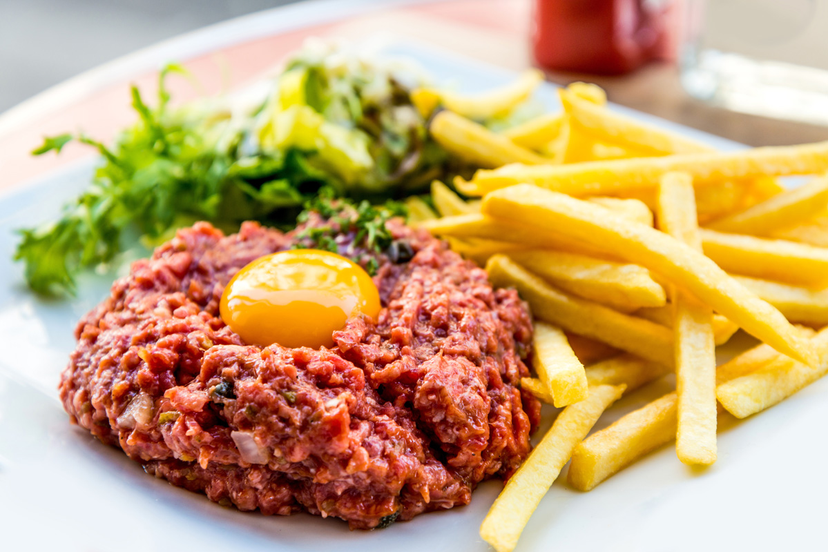  Steak Tartare (minced raw beef prepared with brandy and Tabasco then topped with an egg… much more delicious than it sounds).