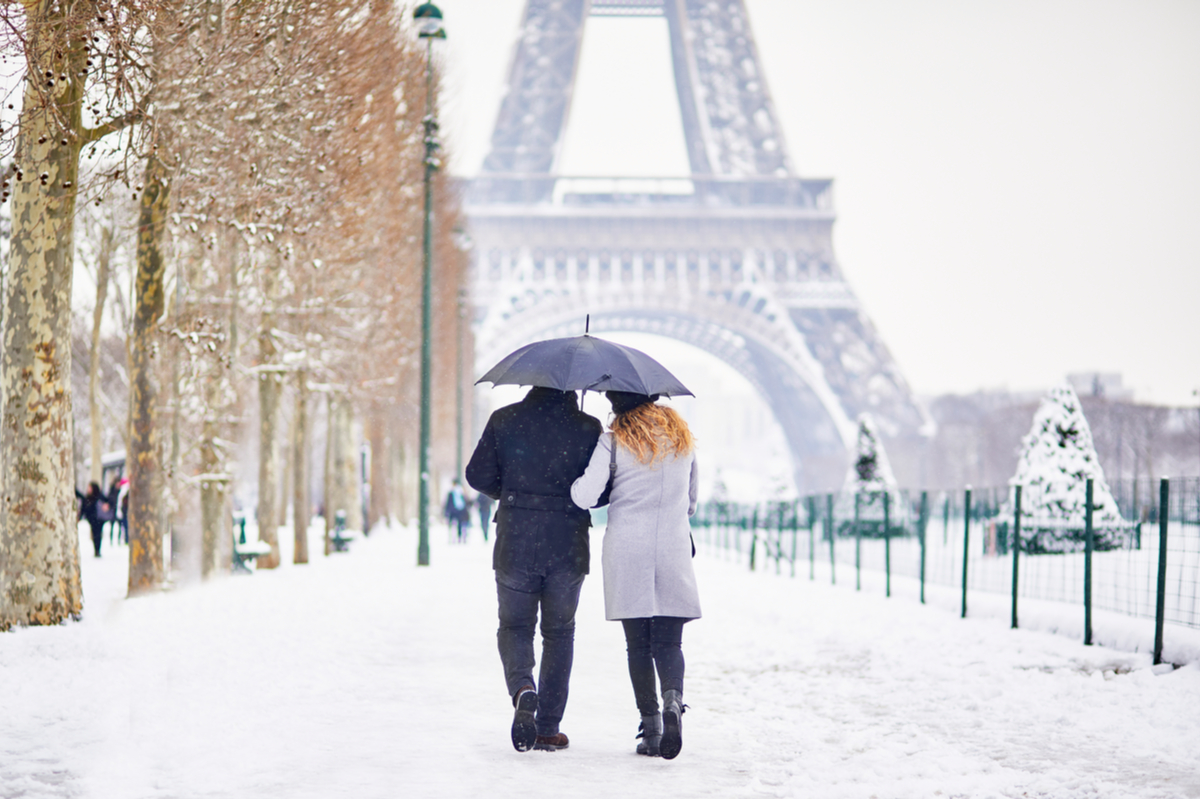 Couple walking near Eiffel Tower Paris winter holiday Europe