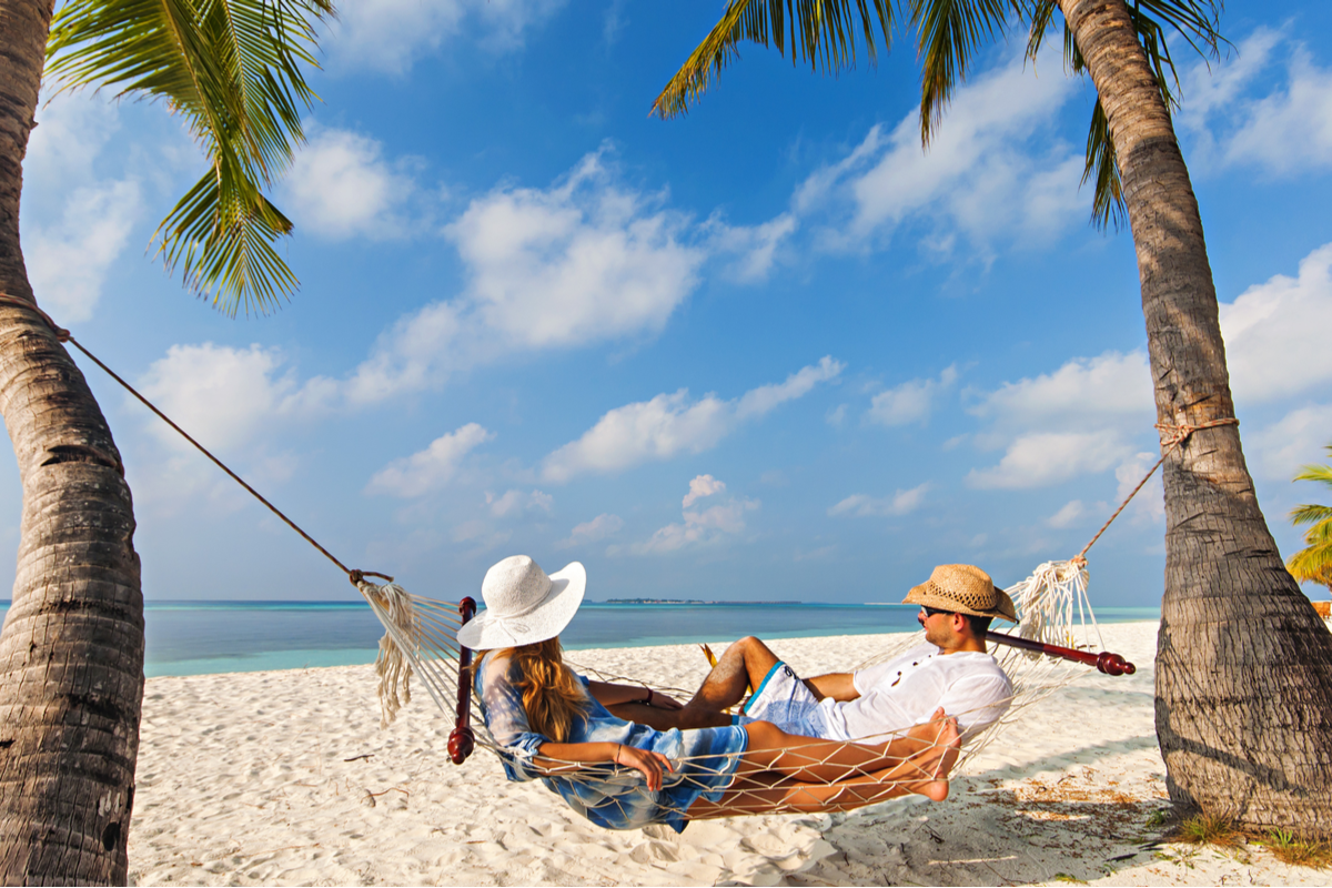 Couple relax on hammock in Maldives Valentine's Day