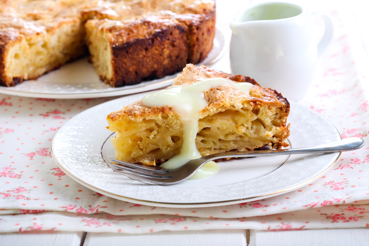 Slice of Irish apple cake with custard St. Patrick's Day