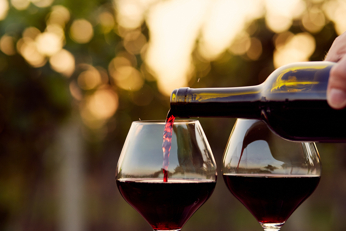 Pouring red wine two glasses