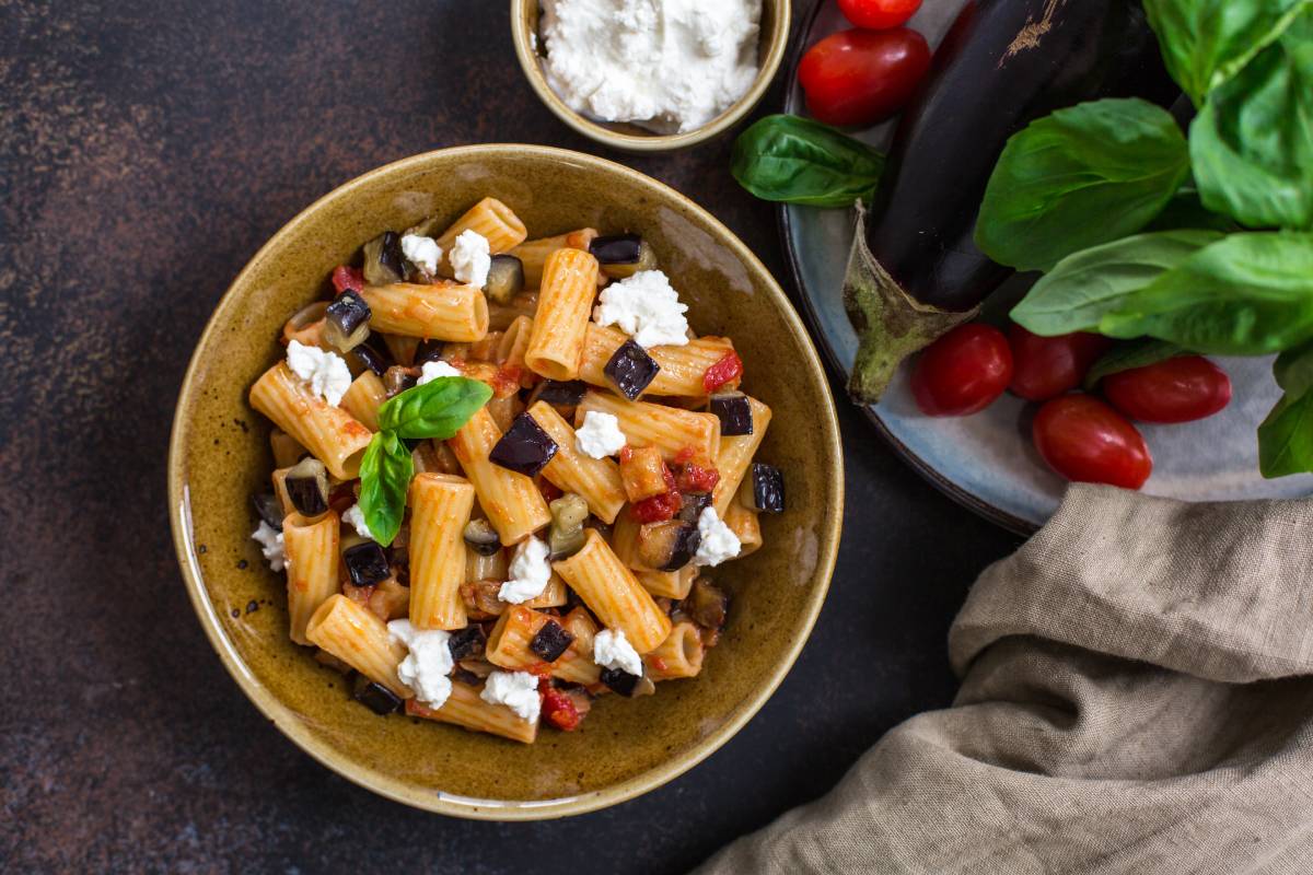 A bowl filled with Pasta alla Norma, World Pasta Day