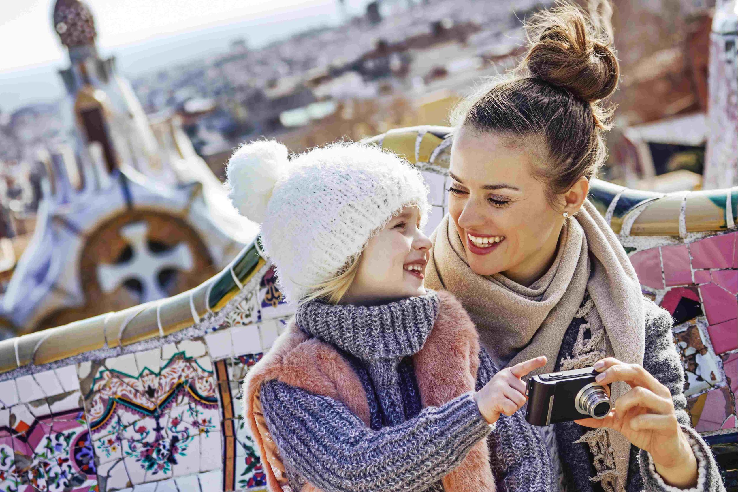 Mother and daughter smile in Park Guell, Barcelona Spain 