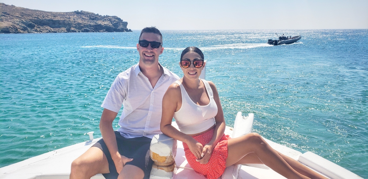 Couple on sightseeing boat tour in Greece