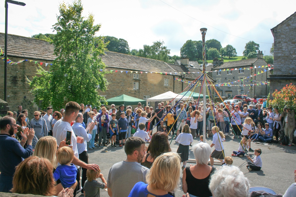 Small village maypole dancing in England British Traditions
