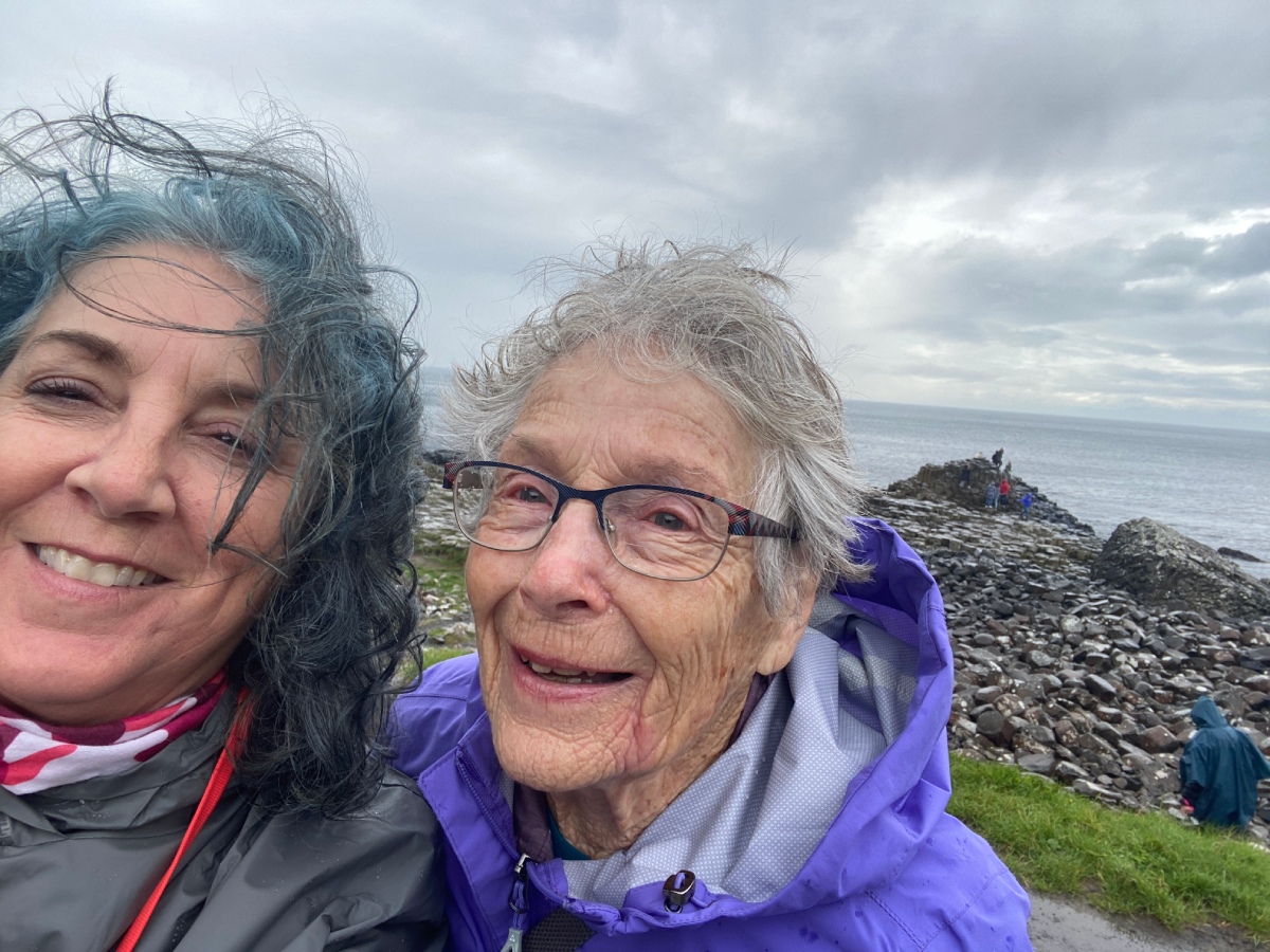 Mother and daughter travellers visit the Giant's Causeway in northern Ireland