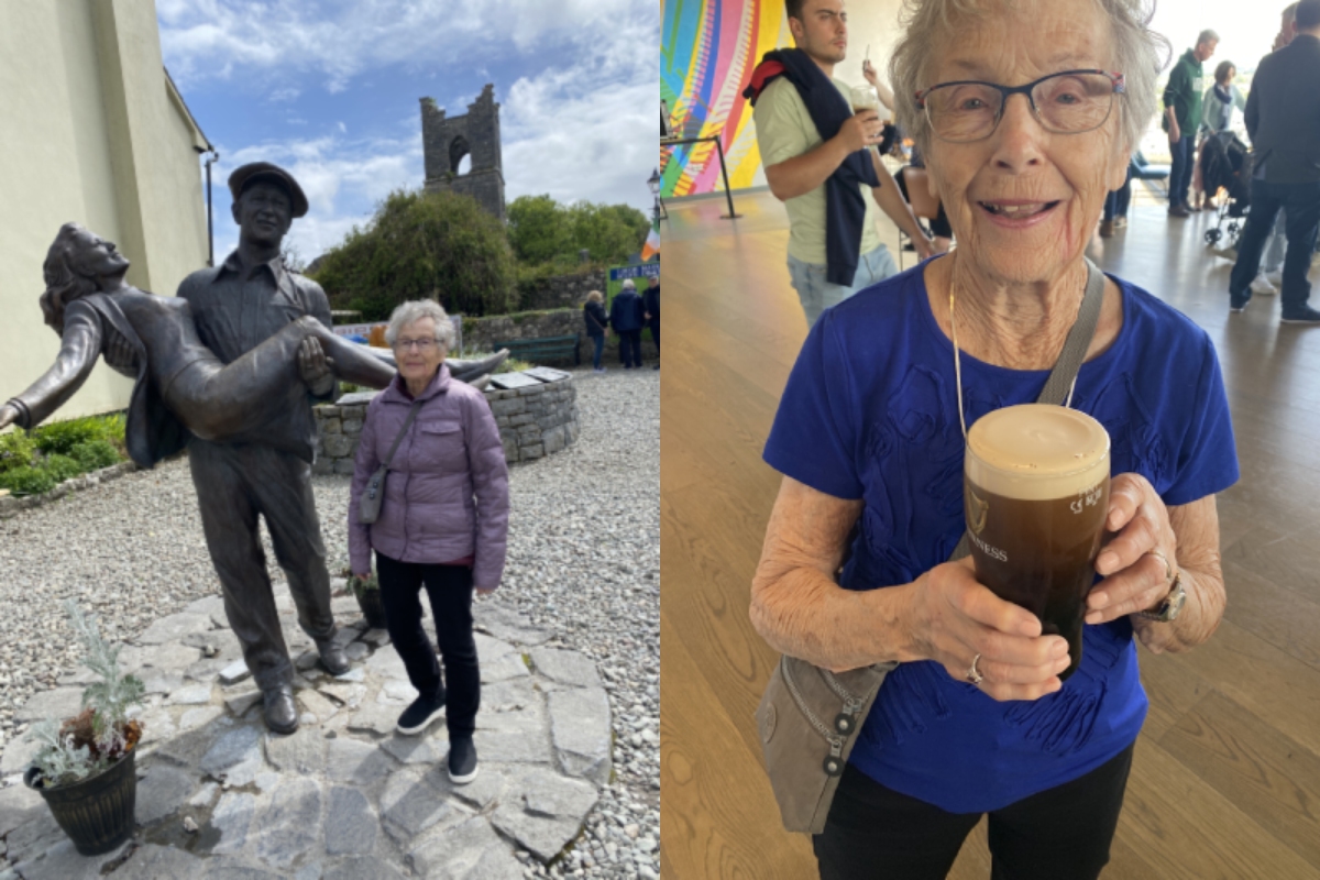 Senior traveller with The Quiet Man Statue and Guinness in Ireland