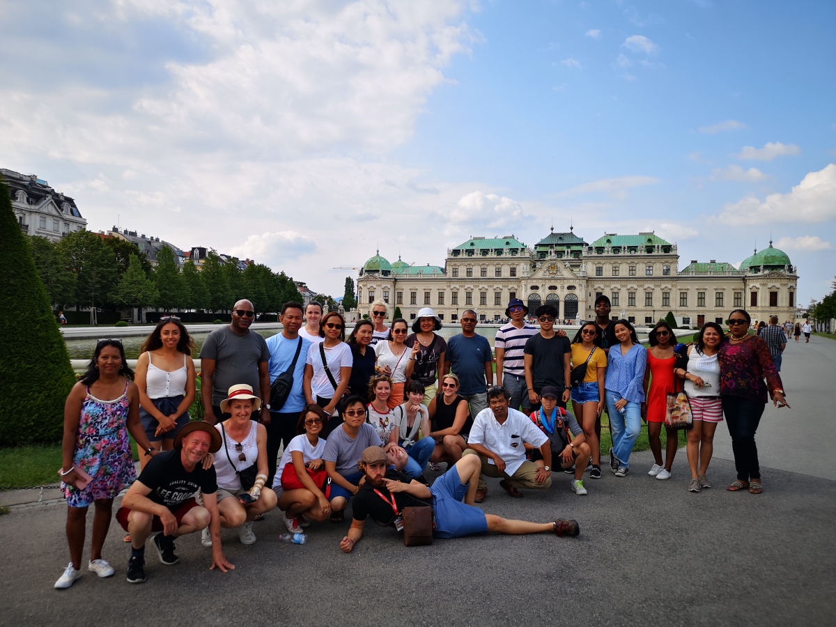 Tour leader and tour group at Belvedere Palace in Vienna