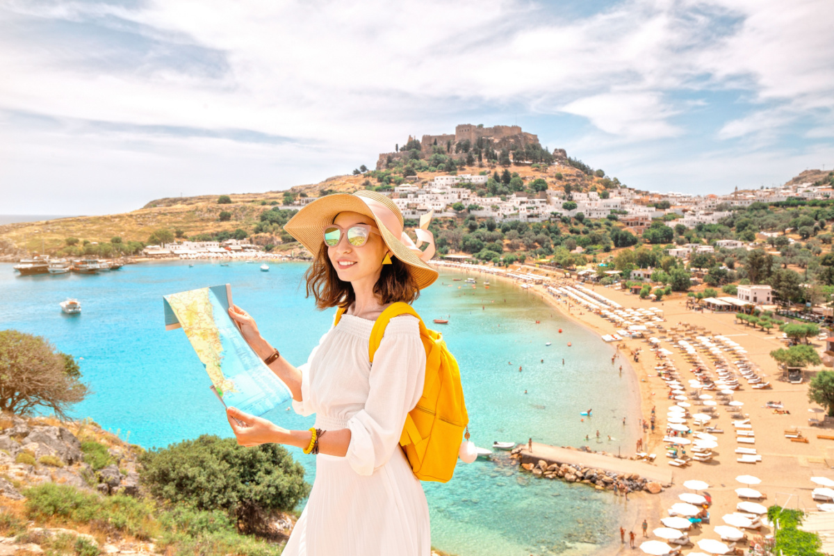 Girl with map in Greece