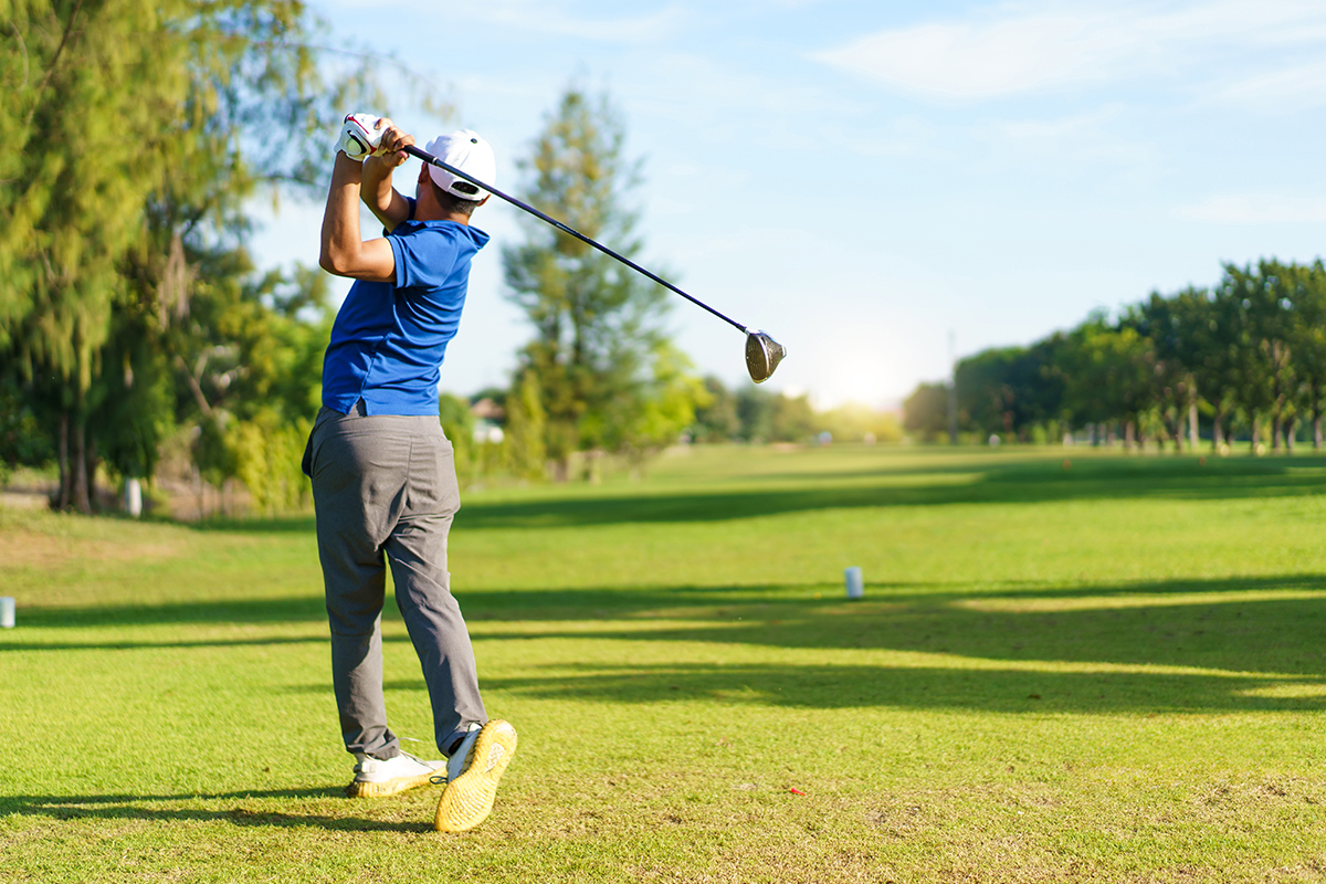 Golf swing caught in action.