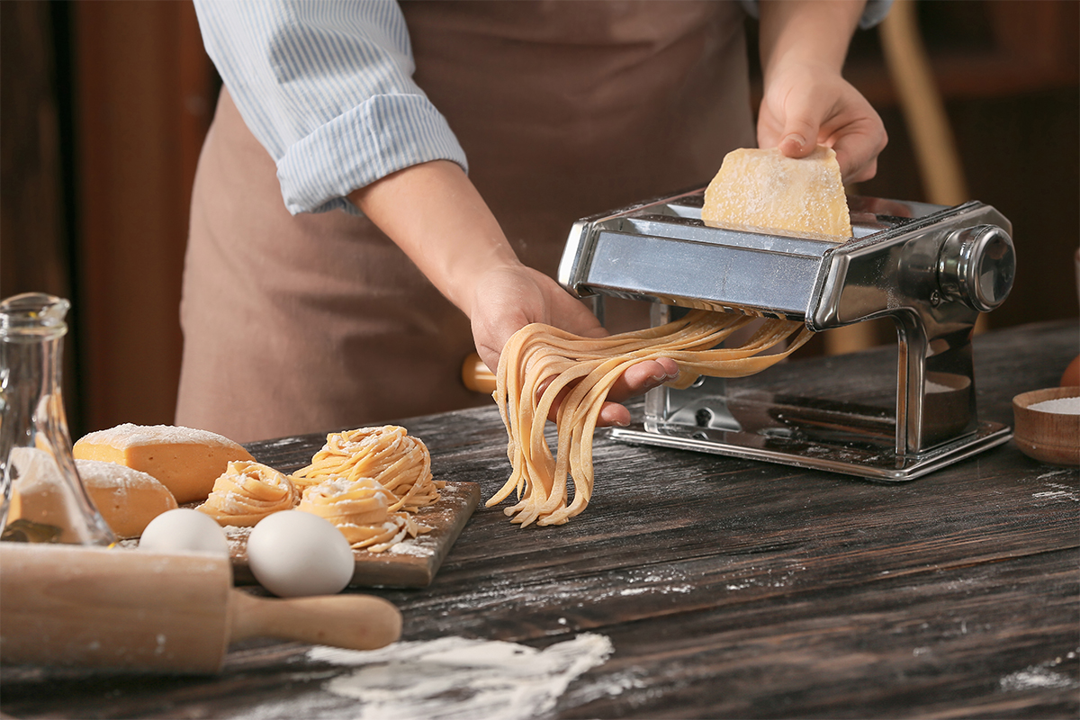 Pasta being made in a machine.